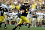 ANN ARBOR, MI - SEPTEMBER 12:  Quarterback Tate Forcier #5 of Michigan runs for a touchdown late in the fourth quarter against Notre Dame at Michigan Stadium on September 12, 2009 in Ann Arbor, Michigan.  (Photo by Domenic Centofanti/Getty Images)