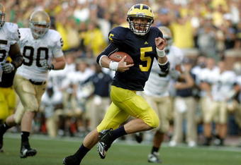 ANN ARBOR, MI - SEPTEMBER 12:  Quarterback Tate Forcier #5 of Michigan runs for a touchdown late in the fourth quarter against Notre Dame at Michigan Stadium on September 12, 2009 in Ann Arbor, Michigan.  (Photo by Domenic Centofanti/Getty Images)