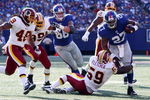 EAST RUTHERFORD, NJ - SEPTEMBER 13:  Brandon Jacobs #27 of the New York Giants runs the ball against the Washington Redskins on September 13, 2009 at Giants Stadium in East Rutherford, New Jersey.  (Photo by Jim McIsaac/Getty Images)