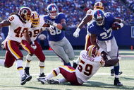 EAST RUTHERFORD, NJ - SEPTEMBER 13:  Brandon Jacobs #27 of the New York Giants runs the ball against the Washington Redskins on September 13, 2009 at Giants Stadium in East Rutherford, New Jersey.  (Photo by Jim McIsaac/Getty Images)