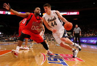 NEW YORK - MARCH 10:  Gregory Echenique #00 of the Rutgers Scarlet Knights defends against Luke Harangody #44 of the Notre Dame Fighting Irish during the first round of the Big East Tournament at Madison Square Garden on March 10, 2009 in New York City.  (Photo by Jim McIsaac/Getty Images)