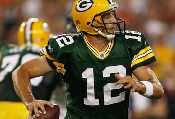 GREEN BAY, WI - SEPTEMBER 13: Aaron Rodgers #12 of the Green Bay Packers rolls out to find a receiver against the Chicago Bears on September 13, 2009 at Lambeau Field in Green Bay, Wisconsin. The Packers defeated the Bears 21-15. (Photo by Jonathan Daniel/Getty Images)
