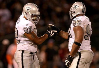 OAKLAND, CA - SEPTEMBER 14:  Richard Seymour #92 and Tommy Kelly #93 of the Oakland Raiders shake hands after a big play during their game against the San Diego Chargers on September 14, 2009 at the Oakland-Alameda County Coliseum in Oakland, California.  (Photo by Ezra Shaw/Getty Images)
