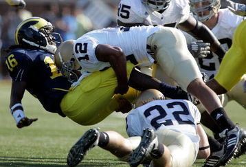 ANN ARBOR, MI - SEPTEMBER 12:  Denard Robinson #16 of Michigan gets tackled by Robert Blanton #12 of Notre Dame at Michigan Stadium on September 12, 2009 in Ann Arbor, Michigan.  (Photo by Domenic Centofanti/Getty Images)