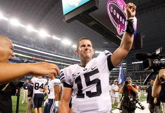 ARLINGTON, TX - SEPTEMBER 05:  Quarterback Max Hall #15 of the Brigham Young Cougars celebrates a 14-13 win against the Oklahoma Sooners at Cowboys Stadium on September 5, 2009 in Arlington, Texas.  (Photo by Ronald Martinez/Getty Images)