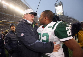 SEATTLE - DECEMBER 21: Head coach Mike Holmgrem of the Seattle Seahawks is congratulated by Ty Law #22 of New York Jets on December 21, 2008 at Qwest Field in Seattle, Washington. The Seahawks defeated the Jets 13-3. (Photo by Otto Greule Jr/Getty Images)