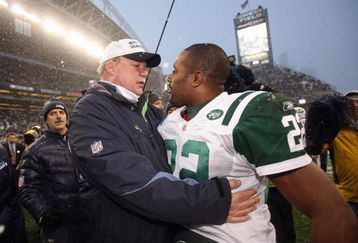 SEATTLE - DECEMBER 21: Head coach Mike Holmgrem of the Seattle Seahawks is congratulated by Ty Law #22 of New York Jets on December 21, 2008 at Qwest Field in Seattle, Washington. The Seahawks defeated the Jets 13-3. (Photo by Otto Greule Jr/Getty Images)