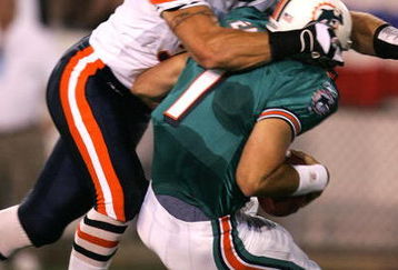 CANTON, OH - AUGUST 8:  Linebacker Brian Urlacher #54 of the Chicago Bears sacks quarterback A.J. Feeley #7 of the Miami Dolphins during the NFL Hall of Fame pre-season game on August 8, 2005 in Canton, Ohio.  (Photo by Jonathan Daniel/Getty Images)