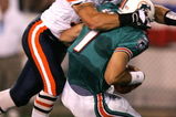 CANTON, OH - AUGUST 8:  Linebacker Brian Urlacher #54 of the Chicago Bears sacks quarterback A.J. Feeley #7 of the Miami Dolphins during the NFL Hall of Fame pre-season game on August 8, 2005 in Canton, Ohio.  (Photo by Jonathan Daniel/Getty Images)