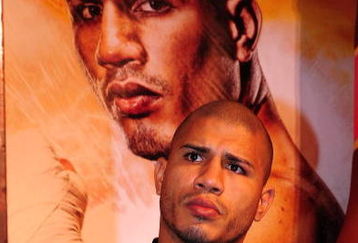 BEVERLY HILLS, CA - SEPTEMBER 14:  Miguel Cotto listens as other speakers talk during the press conference at the Beverly Hills Hotel on September 14, 2009 in Beverly Hills, California.  (Photo by Jacob de Golish/Getty Images)