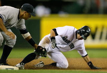 SEATTLE  - AUGUST 15:  Ichiro Suzuki #51 of the Seattle Mariners is tagged out on a steal attempt at third base by Alex Rodriguez #13 of the New York Yankees on August 15, 2009 at Safeco Field in Seattle, Washington. (Photo by Otto Greule Jr/Getty Images)