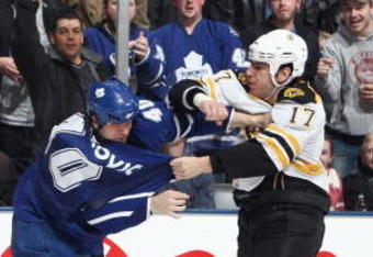 TORONTO - MARCH 28:  Milan Lucic of the Boston Bruins fights with Phil Oreskovic #40 of the Toronto Maple Leafs during the NHL game at the Air Canada Centre on March 28, 2009 in Toronto, Ontario. (Photo by: Dave Sandford/Getty Images)