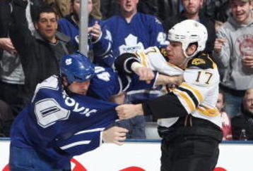 TORONTO - MARCH 28:  Milan Lucic of the Boston Bruins fights with Phil Oreskovic #40 of the Toronto Maple Leafs during the NHL game at the Air Canada Centre on March 28, 2009 in Toronto, Ontario. (Photo by: Dave Sandford/Getty Images)