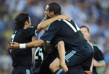 BARCELONA, SPAIN - SEPTEMBER 12:  Marcelo (R) and Raul Gonzalez (L) of Real Madrid celebrate with team mate Guti after he scored their second goal during the La Liga match between Espanyol and Real Madrid at the Nuevo Estadio de Cornella-El Prat stadium on September 12, 2009 in Barcelona, Spain.  (Photo by Denis Doyle/Getty Images)