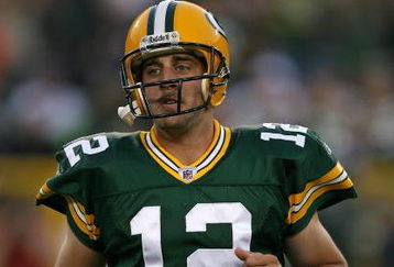 GREEN BAY, WI - SEPTEMBER 13: Aaron Rodgers #12 of the Green Bay Packers participates in warm-ups before a game against the Chicago Bears on September 13, 2009 at Lambeau Field in Green Bay, Wisconsin. (Photo by Jonathan Daniel/Getty Images)