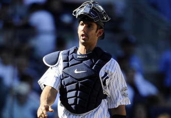 NEW YORK - SEPTEMBER 13: Jorge Posada #20 of the New York Yankees walks to the dugout in a game against the Baltimore Orioles at Yankee Stadium on September 13, 2009 in the Bronx borough of New York City.  (Photo by Jeff Zelevansky/Getty Images)