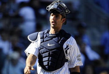 NEW YORK - SEPTEMBER 13: Jorge Posada #20 of the New York Yankees walks to the dugout in a game against the Baltimore Orioles at Yankee Stadium on September 13, 2009 in the Bronx borough of New York City.  (Photo by Jeff Zelevansky/Getty Images)