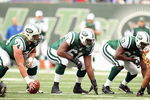 EAST RUTHERFORD, NJ - NOVEMBER 04: Nick Mangold #74, Adrien Clarke #61 and D'Brickashaw Ferguson #60 of the New York Jets get ready on the line against the Washington Redskins during their game on November 4, 2007 at Giants Stadium in East Rutherford, New Jersey. (Photo by Al Bello/Getty Images) 