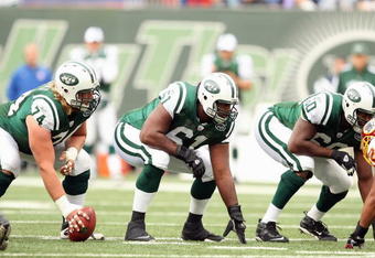EAST RUTHERFORD, NJ - NOVEMBER 04: Nick Mangold #74, Adrien Clarke #61 and D'Brickashaw Ferguson #60 of the New York Jets get ready on the line against the Washington Redskins during their game on November 4, 2007 at Giants Stadium in East Rutherford, New Jersey. (Photo by Al Bello/Getty Images) 