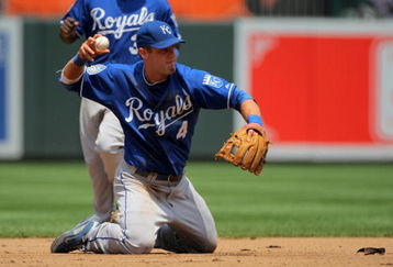 BALTIMORE - JULY 30:  Third baseman Alex Gordon #4 of the Kansas City Royals throws out a runner as he plays defense against the Baltimore Orioles during MLB action at Oriole Park at Camden Yards on July 30, 2009 in Baltimore, Maryland. The Orioles defeated the Royals 7-3.  (Photo by Doug Pensinger/Getty Images)