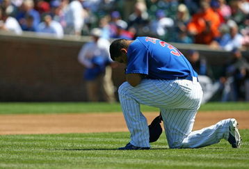 CHICAGO - AUGUST 30: Carlos Zambrano #38 of the Chicago Cubs takes a moment to himself before the first pitch against the New York Mets on August 30, 2009 at Wrigley Field in Chicago, Illinois. The Mets defeated the Cubs 4-1. (Photo by Jonathan Daniel/Getty Images)