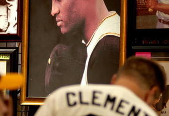 PITTSBURGH - JULY 7: Fans look over Roberto Clemente memorabilia during opening day of Fan Fest for the Major League Baseball 2006 All-Star game at the David L. Lawrence Convention Center July 7, 2006 in Pittsburgh, Pennsylvania. (Photo by Paul Hawthorne/Getty Images)