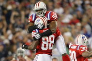 FOXBORO, MA - SEPTEMBER 14:  Adalius Thomas #96 and Sam Aiken #88 of the New England Patriots celebrate after teammate Stephen Gostkowski #3 recovered a fumble by Leodis McKelvin of the Buffalo Bills on September 14, 2009 at Gillette Stadium in Foxboro, Massachusetts. The Patriots defeated the Bills 25-24.  (Photo by Elsa/Getty Images)