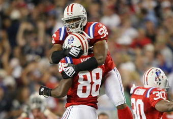 FOXBORO, MA - SEPTEMBER 14:  Adalius Thomas #96 and Sam Aiken #88 of the New England Patriots celebrate after teammate Stephen Gostkowski #3 recovered a fumble by Leodis McKelvin of the Buffalo Bills on September 14, 2009 at Gillette Stadium in Foxboro, Massachusetts. The Patriots defeated the Bills 25-24.  (Photo by Elsa/Getty Images)