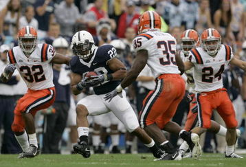 STATE COLLEGE, PA - SEPTEMBER 12: Tail back Evan Royster #22 of the Penn State Nittany Lions rushes through linebacker Doug Hogue #32 and safety Mike Holmes #35 of the Syracuse Orangemen during the first half at Beaver Stadium  September 12, 2009 in State College, Pennsylvania. (Photo by Chris Gardner/Getty Images)
