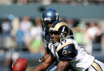 SEATTLE - SEPTEMBER 13:  Wide receiver Donnie Avery #17 of the St. Louis Rams makes a catch against Leroy Hill #56 of the Seattle Seahawks on September 13, 2009 at Qwest Field in Seattle, Washington. (Photo by Otto Greule Jr/Getty Images)