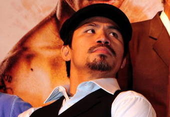 BEVERLY HILLS, CA - SEPTEMBER 14: Manny Pacquiao listens as other speakers speak during the press conference at the Beverly Hills Hotel on September 14, 2009 in Beverly Hills, California.  (Photo by Jacob de Golish/Getty Images)