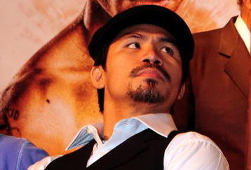 BEVERLY HILLS, CA - SEPTEMBER 14: Manny Pacquiao listens as other speakers speak during the press conference at the Beverly Hills Hotel on September 14, 2009 in Beverly Hills, California.  (Photo by Jacob de Golish/Getty Images)