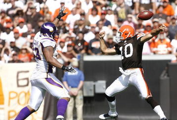 CLEVELAND - SEPTEMBER 13:  Brady Quinn #10 of the Cleveland Browns fumbles the ball as he is pressured by Kevin Williams #93 of the Minnesota Vikings at Cleveland Browns Stadium on September 13, 2009 in Cleveland, Ohio.  (Photo by Matt Sullivan/Getty Images)