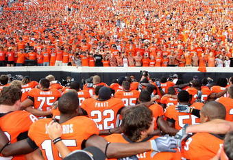 STILLWATER, OK - SEPTEMBER 5:  The Oklahoma State Cowboys sing their school's Alma Mater with fans after their 24-10 victory over the Georgia Bulldogs at Boone Pickens Stadium on September 5, 2009 in Stillwater, Oklahoma. (Photo by Christian Petersen/Getty Images)