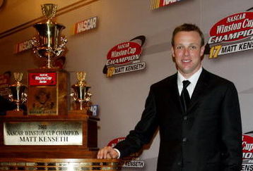 NEW YORK - DECEMBER 05: NASCAR driver Matt Kenseth poses with 1st place trophy in press room during the 2003 NASCAR Winston Cup Awards at the Waldorf Astoria Hotel December 05, 2003 in New York City.   (Photo by Matthew Peyton/Getty Images)