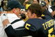ANN ARBOR, MI - SEPTEMBER 12: Quarterback Tate Forcier #5 embraces head coach Rich Rodriguez as they approach the tunnel after beating Notre Dame 38-34 at Michigan Stadium on September 12, 2009 in Ann Arbor, Michigan. (Photo by Domenic Centofanti/Getty Images)