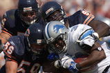 CHICAGO - SEPTEMBER 12: Joe Odom #59, Brian urlacher #54 and Alex brown # 96 of the Chicago Bears combine to tackle Kevin Jones #34 of the Detroit Lions during a game on September 12, 2004 at Soldier Field in Chicago, Illinois. The Lions defeated the Bears 20-16. (Photo by Jonathan Daniel/Getty Images)