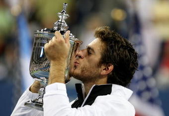 NEW YORK - SEPTEMBER 14:  Juan Martin Del Potro of Argentina kisses the championship trophy after defeating Roger Federer of Switzerland in the Men's Singles final on day fifteen of the 2009 U.S. Open at the USTA Billie Jean King National Tennis Center on September 14, 2009 in the Flushing neighborhood of the Queens borough of New York City. Del Potro defeated Federer 3-6, 7-6 (7), 4-6, 7-6 (7), 6-2.  (Photo by Al Bello/Getty Images)