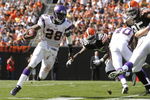 CLEVELAND - SEPTEMBER 13:  Adrian Peterson #28 of the Minnesota Vikings runs around the defense of the Cleveland Browns at Cleveland Browns Stadium on September 13, 2009 in Cleveland, Ohio.  (Photo by Matt Sullivan/Getty Images)