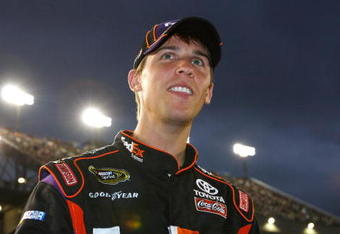 RICHMOND, VA - SEPTEMBER 12:  Denny Hamlin, driver of the #11 FedEx Toyota, stands on pit road prior to the NASCAR Sprint Cup Series Chevy Rock & Roll 400 at Richmond International Raceway on September 12, 2009 in Richmond, Virginia.  (Photo by Chris Graythen/Getty Images)