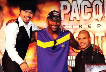 BEVERLY HILLS, CA - SEPTEMBER 14:  Manny Pacquiao, Miguel Cotto and Ron Artest all  pose for pictures during the press conference at the Beverly Hills Hotel on September 14, 2009 in Beverly Hills, California.  (Photo by Jacob de Golish/Getty Images)