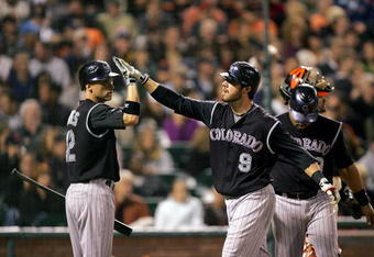 SAN FRANCISCO - SEPTEMBER 16:  Ian Stewart #9 of the Colorado Rockies is congratulated by Clint Barmes #12 after he hit a two-run home run to give the Rockies a 4-0 lead over the San Francisco Giants in the sixth inning of their game at AT&T Park on September 16, 2009 in San Francisco, California.  (Photo by Ezra Shaw/Getty Images)