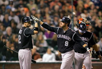 SAN FRANCISCO - SEPTEMBER 16:  Ian Stewart #9 of the Colorado Rockies is congratulated by Clint Barmes #12 after he hit a two-run home run to give the Rockies a 4-0 lead over the San Francisco Giants in the sixth inning of their game at AT&T Park on September 16, 2009 in San Francisco, California.  (Photo by Ezra Shaw/Getty Images)
