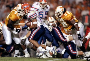 19 Sep 1998:  Robert Gillespie #20 of the Florida Gators tucks the ball as he runs up field during the game against the Tennesse Volunteers at Neyland Stadium in Knoxville, Tennesse.Tennesse Volunteers defeated the Florida Gators 20-17. Mandatory Credit: