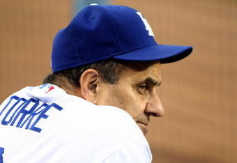 LOS ANGELES - AUGUST 21:  Manager Joe Torre of the Los Angeles Dodgers looks on in the dugout before the game with the Chicago Cubs on August 21, 2009 at Dodger Stadium in Los Angeles, California.    (Photo by Stephen Dunn/Getty Images)