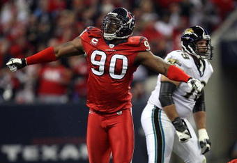 HOUSTON - DECEMBER 01:  Defensive tackle Mario Williams #90 of the Houston Texans reacts after making a quarterback sack against David Garrard #9 of the Jacksonville Jaguars at Reliant Stadium on December 1, 2008 in Houston, Texas.  (Photo by Ronald Martinez/Getty Images)