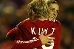 LIVERPOOL, ENGLAND - SEPTEMBER 16:  Dirk Kuyt of Liverpool celebrates scoring the opening goal with team mate Fernando Torres during the UEFA Champions League Group E match between Liverpool and Debrecen VSC at Anfield on September 16, 2009 in Liverpool, England.  (Photo by Alex Livesey/Getty Images)