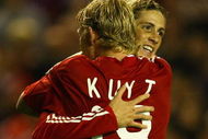 LIVERPOOL, ENGLAND - SEPTEMBER 16:  Dirk Kuyt of Liverpool celebrates scoring the opening goal with team mate Fernando Torres during the UEFA Champions League Group E match between Liverpool and Debrecen VSC at Anfield on September 16, 2009 in Liverpool, England.  (Photo by Alex Livesey/Getty Images)