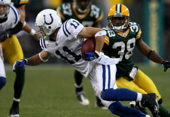 GREEN BAY, WI - OCTOBER 19:  Wide receiver Anthony Gonzalez  #11 of the Indianapolis Colts carries the ball after a catch against the Green Bay Packers on October 19, 2008 at Lambeau Field in Green Bay Wisconsin. The Packers won 34-14.  (Photo by Stephen Dunn/Getty Images)