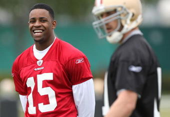 SANTA CLARA, CA - MAY 01:  Michael Crabtree #15 of the San Francisco 49ers looks on during practice as quaterback Alex Smith #11 practices during the 49ers Minicamp at their training facilities on May 1, 2009 in Santa Clara, California. Crabtree was the 49ers first round draft pick.  (Photo by Jed Jacobsohn/Getty Images)